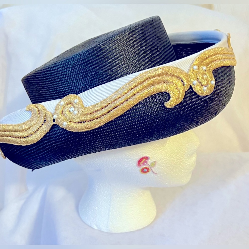 Adolfo II 90’s black straw hat with white, gold and pearl embellishments.